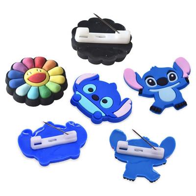 China Soft Drag Charm Designer PVC Cartoon Brooch PVC Brooches Pins for sale