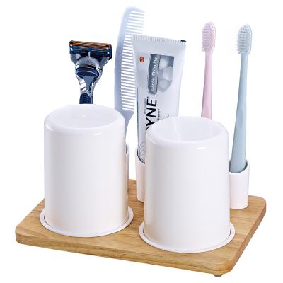 China Sustainable Modern Dental Stuff Rack Natural Wooden Bathroom Accessories Base Toothbrush Holder Set for sale