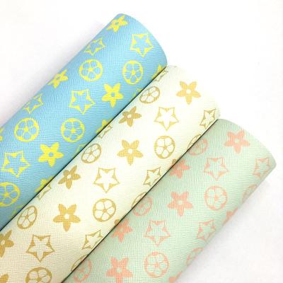 China Wholesale Wrinkle Resistant DIY Crafts Faux PU Leather Star Printed Leather Synthetic Leather for sale