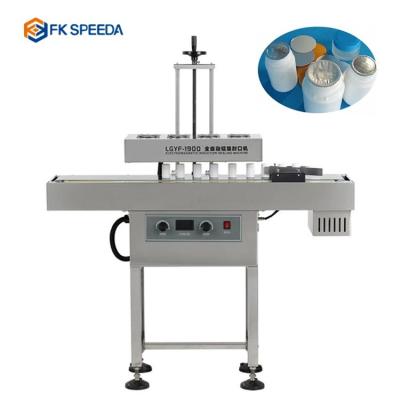 China FK4200 Small Plastic Bottle Aluminum Foil Sealing Machine for Packing Production Line for sale