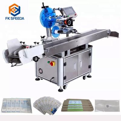 China Case Packaging Type Plastic Flat Label Applicator Machine for Cosmetic Pouch Bag Labeling for sale