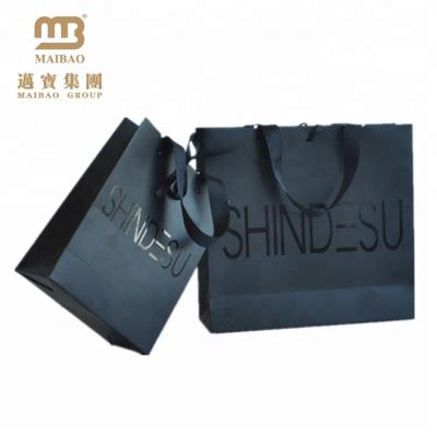 China Recyclable Custom Design Ribbon Handle Black Luxury Packaging 250 Gsm Art Paper Bag For Clothes Apparel Retail Shopping for sale