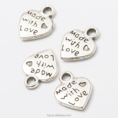 China Silver Plated Double Side Fashionable Jewelry Alloy Love Heart Pendant Charms for sale