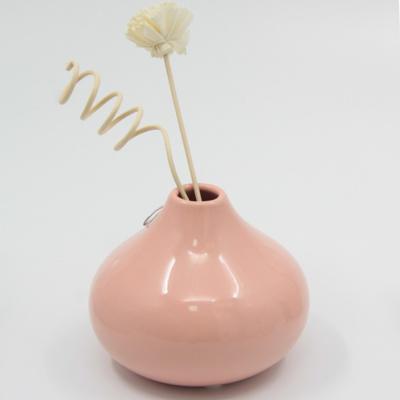 China Anti-Smell Cheap Personalized Decorative Ceramic Aroma Empty Perfume Bottle For Fresh Indoor Air for sale