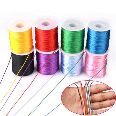 China Sustainable 100M/Reel Assorted Color 1.5mm Nylon Macrame Chinese Knotting Rattail Braided Satin Cord Thread String for DIY Jewelry Making for sale