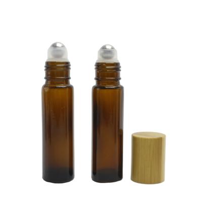 China Personal Care Amber Roll On Perfume Bottles Essential Oil Roller Bottle With Steel Roller And Bamboo Lid RL-AN20 for sale