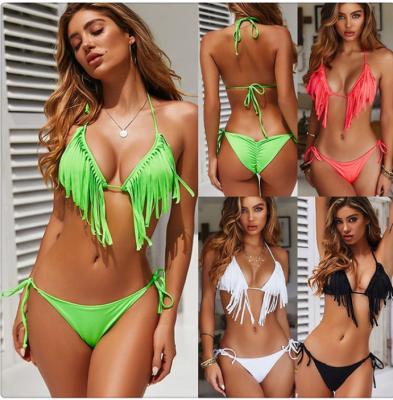 China Fashionable Polyester GCC Tassel Chest Pad Gather Fluorescent Solid Color Women Swimwear Slit Bikini for sale