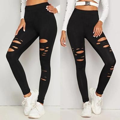 China Autumn Ladies Solid Color Holes Breathable Slim Ripped Cavity Stretch Tight Leggings Sports Outer Wear Yoga Pants for sale