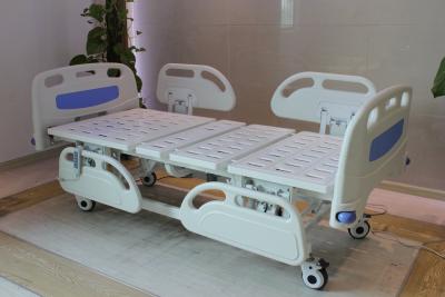 China Five Functions Electric Hospital Bed with PP side rails , Home Care Beds With Individual Locking Casters for sale