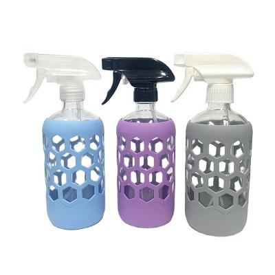 China Personal Care 16oz Clear Glass Refillable Spray Bottle With Anti-Slip Silicone Sleeve for sale