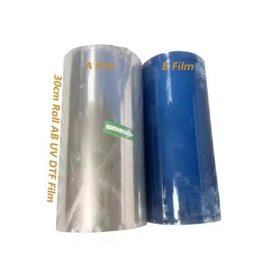 China Polymer Cold Transfer Printing Film A And B Film UV DTF PET Sticker Film Roll 30cm for sale