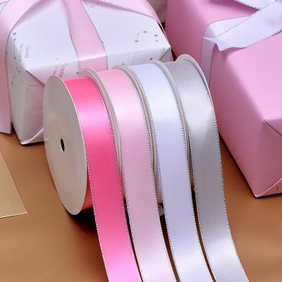 China Ribest Metallic Plain Polyester Satin Ribbon With Silver Edge For Clothing Accessory And Gift Packing 22MM Roll for sale