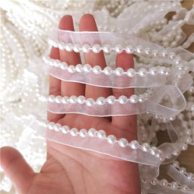 China Viable Snow White Yarn With Single Sided Mother Of Pearl Lace Beads DIY Ribbon Yarn Lace And Hats Accessories for sale