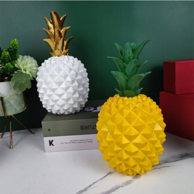 China Central Institute of Statistics Display World Nordic Modern Resin Prop Golden Pineapple For Home Decoration for sale