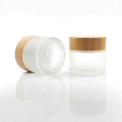 China Wholesale 100% Organic Skin Care Cream Glass Jar With Bamboo Lid Bamboo Glass Cream Jar For Cosmetics for sale