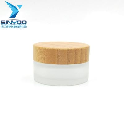 China High Quality Frosted Glass Skin Care Cream Jar With Bamboo Lid 30ml Glass Bamboo Jar for sale