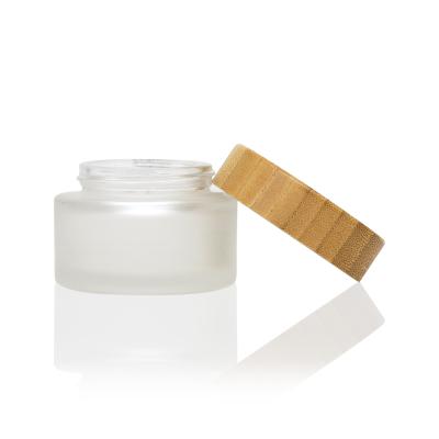 China 2021 new 50ml 60ml 100ml 120ml cream cosmetic matte glass jar with lid skin care bamboo jar for sale