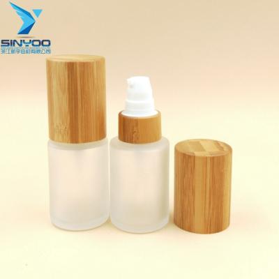 China High End Empty Skin Care Cream 30ml Cream Bottle Customize Bamboo Cosmetic Packaging Pump Glass Bottle With Bamboo Cap for sale