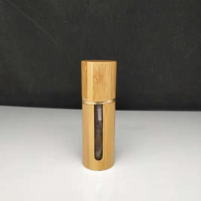 China Cosmetic Pump Bottle Empty Frosted Glass Bamboo Glass Cosmetic Bottle With Bamboo Lid for sale