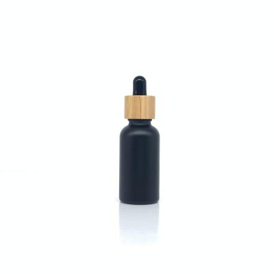 China Wholesale 15ml 30ml 50ml Cosmetic Empty Essential Oil Custom Logo Boston Glass Bottle With Bamboo Dropper Lid for sale