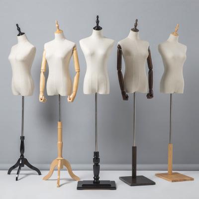 China XINJI Size Cloth Female Mannequins Half Body Mannequin Plastic Mannequin Plus Torso With Strong Wooden Arms for sale