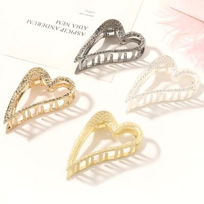 China Korean Alloy CIA Ponytail Hair Clip Hair Holder For Girls Party Claw Gold Heart Hair Clips for sale