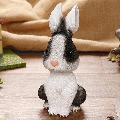 China Money Saving New Arrivals Cute Cartoon Rabbit Shaped Piggy Bank Decoration Resin Home Crafts Kids Invent Money Saving Box for sale