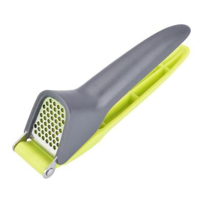 China Amazon Vegetable&Fruit Kitchen Hot Instruments Stocked Plastic Manual Garlic Press Tools Mini Portable Camping Hand Garlic Press for sale