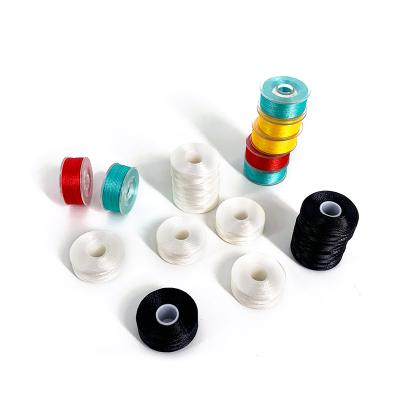 China Abrasion-Resistant 75D/2 Polyester Embroidery Thread Pre Wound Bobbin Thread For Shuttle for sale