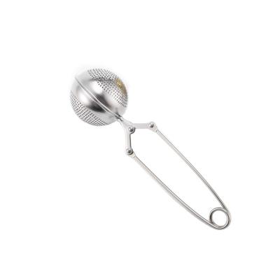 China Desktop portable tea ball press gold stainless steel tea leaf ball wire clip titanium viable filter separation for sale