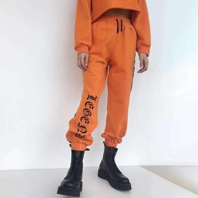 China Autumn And Winter Hot Sale 2021 New Orange Breathable Lace Up Pants Ladies Letters Print Workout Pants for sale