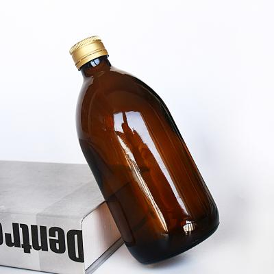 China Personal Care Amber Glass Medicine Bottle Syrup Glass Bottle With Gold Lid for sale