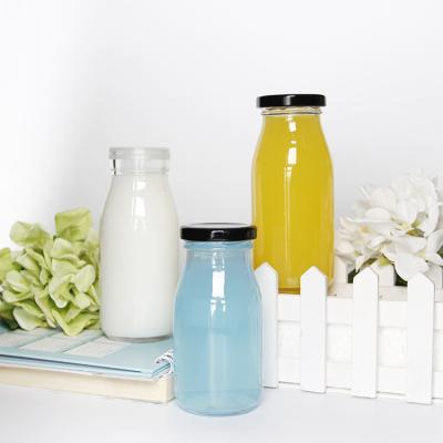 China Glass Bottle 200ml 250ml 300ml Milk Glass Beverage Bottle With Tinplate Cap for sale