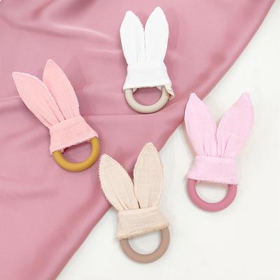 China Cotton Teething Toy Newborn Gift Set Baby Bib Bunny Ear Soft Silicone Ring Teether for sale