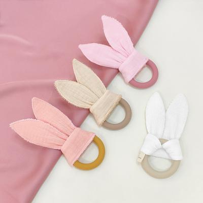 China Soft Silicone Toy Silicone Ring With Fabric Forming Sensory Aid Ring Teething Newborn Bunny Ears Handmade Baby Teether for sale