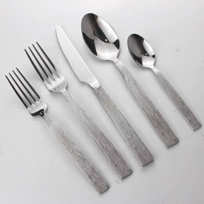 China Food Grade Stainless Steel Vintage Stone Grain Sustainable Grit Hammered Cutlery Set Gold Plated Wedding Flatware for sale