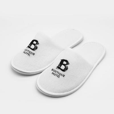 China Comfortable UG Cheap Disposable Slippers Closed Toe Embroidery Personalized Logo Velvet Individually Packaged Indoor Disposable Slippers for sale