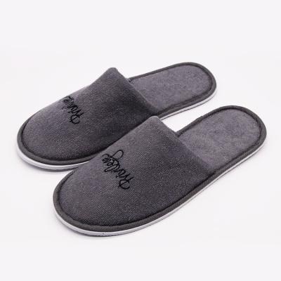 China 5 Star Luxury UG Oem Custom Wholesale Disposable Slippers Gray Closed Toe Embroidered Terry  Slippers Unisex Disposable Slippers For Hotel for sale