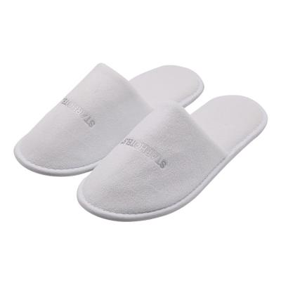 China Indoor Home Outdoor Beach UG Luxury Wholesale Adult Customized Logo Hotel Guestroom SPA Toiletries Supplies Close Toe Warm Disposable Slippers for sale