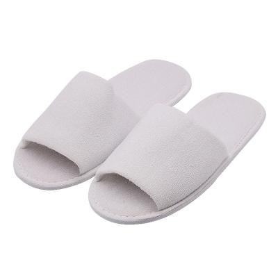 China Fashion Trend UG Classic Hotel Guestroom SPA Toiletries Supplies Wholesale Customized Logo Open Toe Disposable Slippers for sale