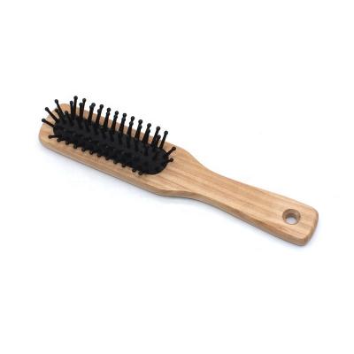 China Small Cushion Natural Wooden Hairbrush Paddle Brush Lotus Wood for sale