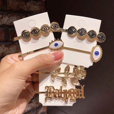 China Fashion Wholesale Style Hair Accessories Metal Retro Hairpins Eyes Hair Clips For Girls for sale