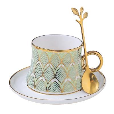 China Viable Hot Selling Fancy Design 8oz 220cc Gold Ceramic Cup And Saucer With Metal Leave Spoon For High-Grade Coffee for sale