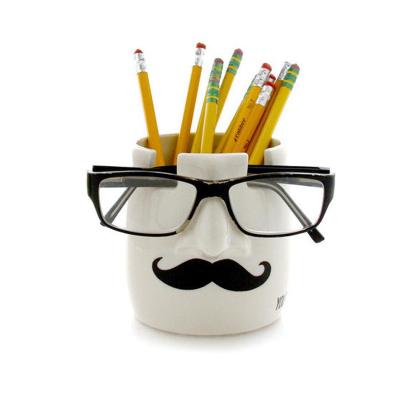 China 100% Unique Ceramic Eco-friendly Human Face Makeup Brushes Holder Glasses Holder Desks Pen Holder Organizer for sale