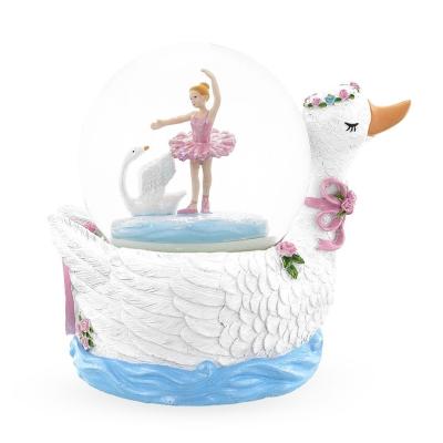 China Custom Nanwei Hot Sale Europe Resin Christmas Snow Globe With Musical Music Swan Lake Ballet Snow Globe for sale