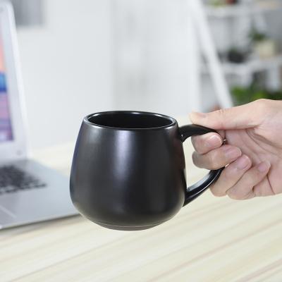 China Good quality viable wholesale customized logo printing matte black color coffee cup large belly milk glaze mug 420ml for sale