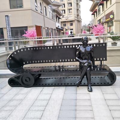 China 2021 Modern World Expo Metal Street Movie Bench with Man Sculpture in Mall Street. for sale