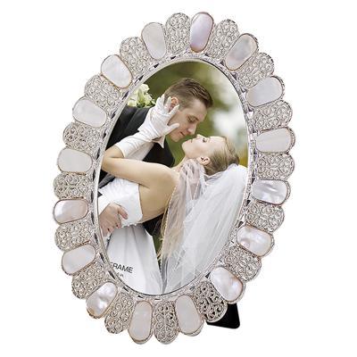 China Shell Photo Frame Metal Picture Oval Environment Friendly Framed Picture Frames 5x7 for sale