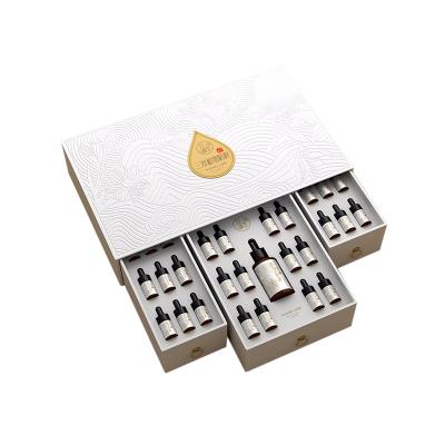 China Recycled Materials Beauty Face Body Skin Care Essential Oil Gift Drawer Box Custom Paper Packaging for sale