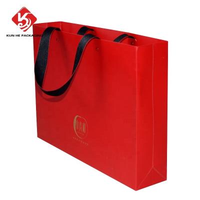 China Customized Recyclable Black White Brown Brown Paper Bag Folding Packaging Flat Handle Kraft Paper Bag For Clothing Shoes Grocery Gifts for sale